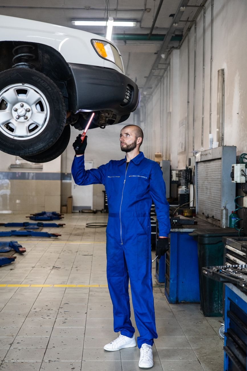 Automotive mechanic repairing a vehicle