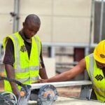 construction workers operating machinery outdoors