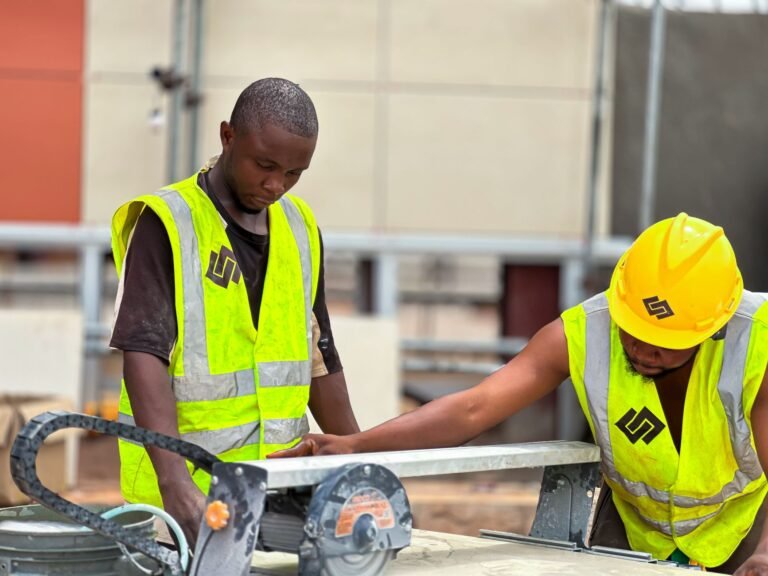 construction workers operating machinery outdoors