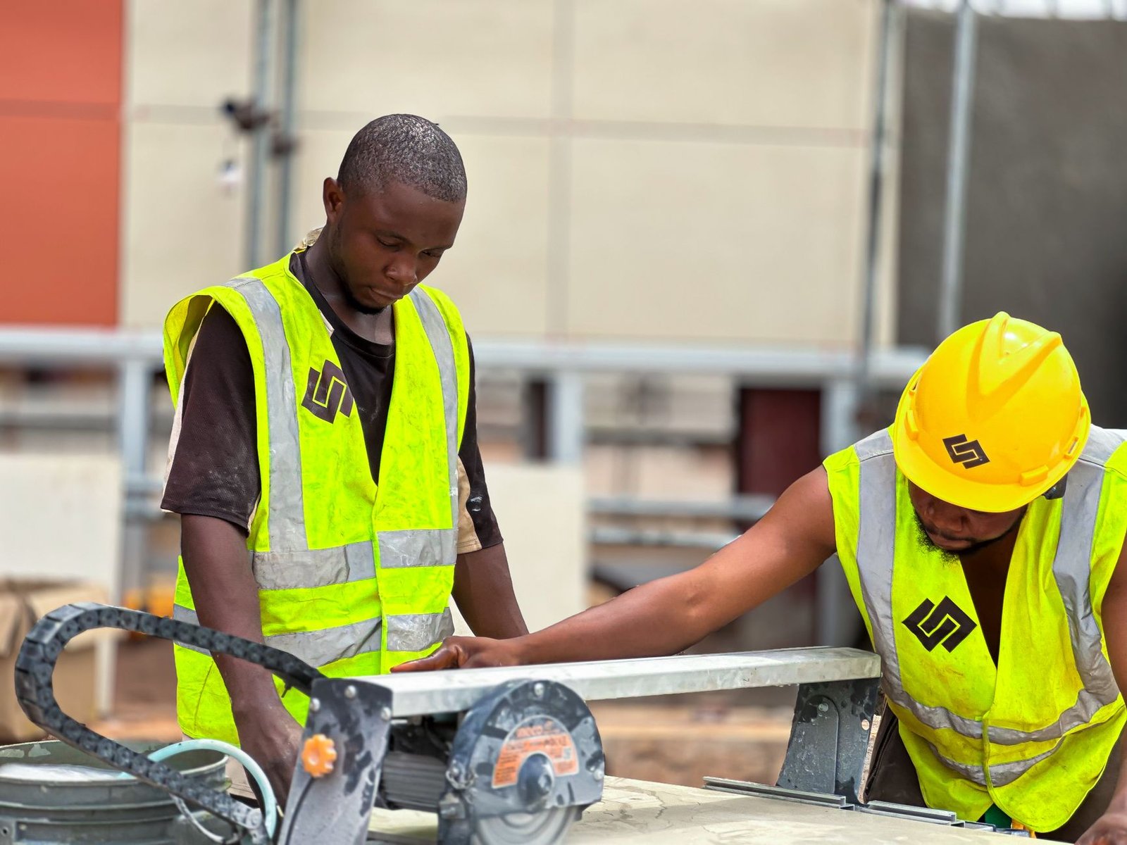 construction workers operating machinery outdoors